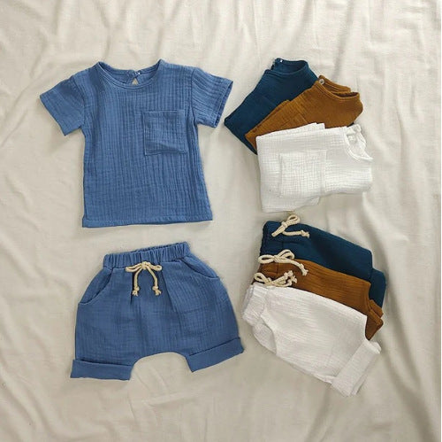 Summer New Arrival Baby Kids Short Sleeves Solid Color T-Shirt in various colors, showcasing its soft cotton fabric and unisex design.