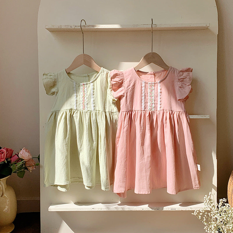 A stylish summer dress for girls featuring fly sleeves and a lace pattern, available in pink and green colors.