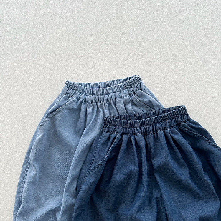 A stylish unisex blue denim with elastic waistband for kids, perfect for summer wear.