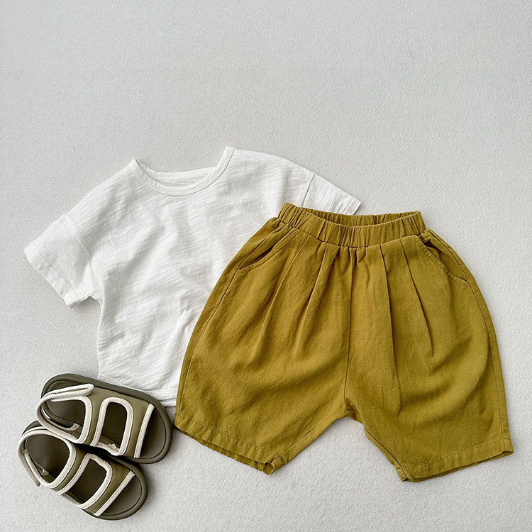 Summer New Arrival Unisex Plain Solid Color Cotton Pants in White, Yellow, and Coffee colors, showcasing their soft fabric and versatile design.