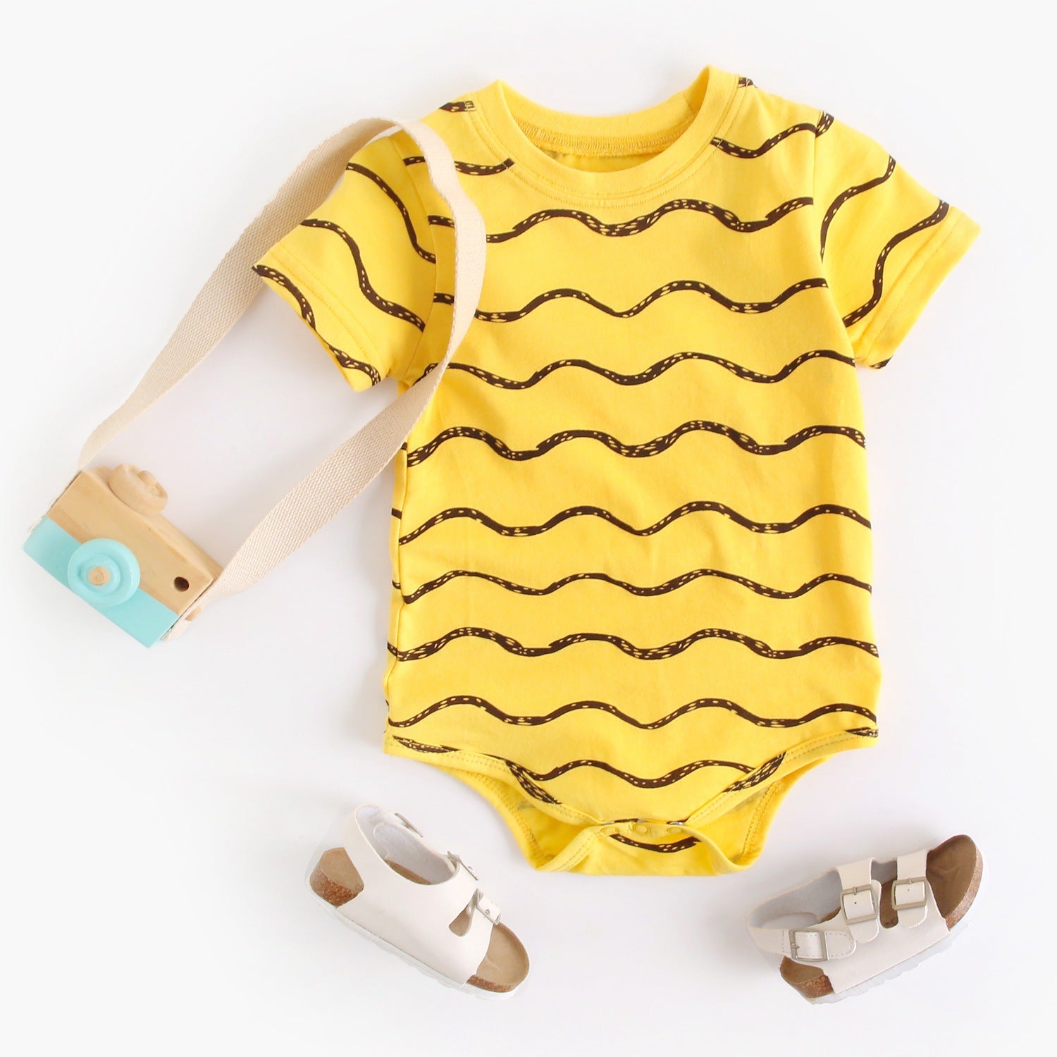 A stylish baby unisex short sleeve crew neck shirt featuring a geometric print in white and yellow colors, perfect for summer wear.