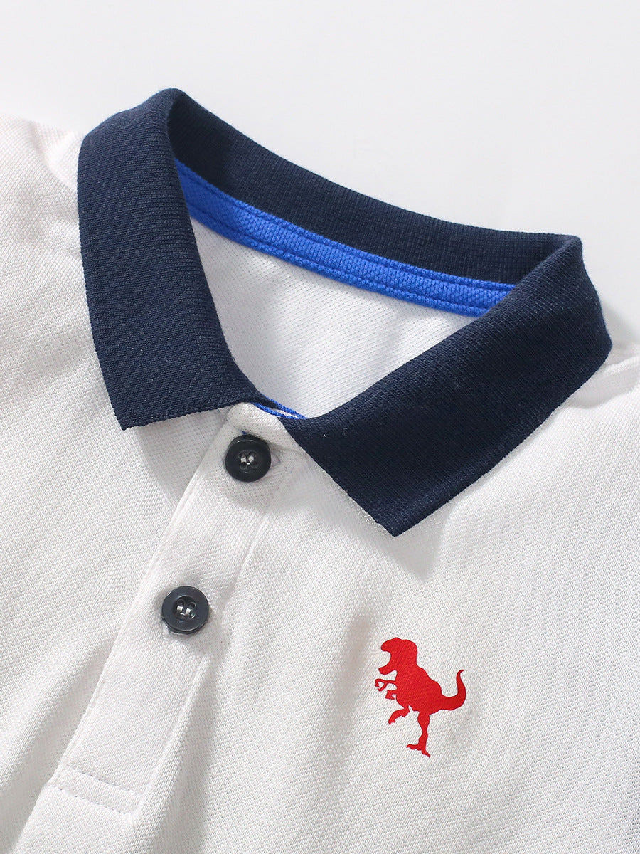 White short-sleeve t-shirt for boys featuring a playful dinosaur logo, made from soft cotton, perfect for summer wear.