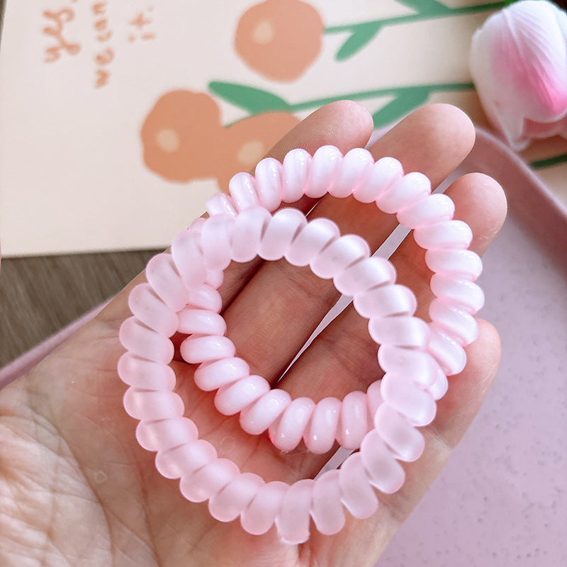 Sweet and Refreshing Matte Telephone Cord Style Hair Tie in pink and blue, designed for baby girls and girls, made from durable resin material.