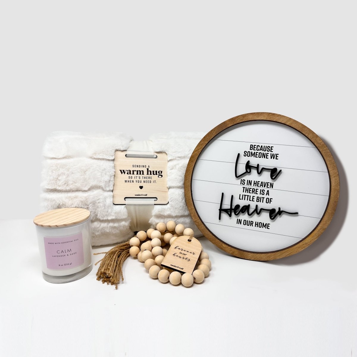 Sympathy Gift Set featuring a cozy faux fur blanket, inspirational wood sign, lavender sage candle, and wood bead garland, beautifully arranged.