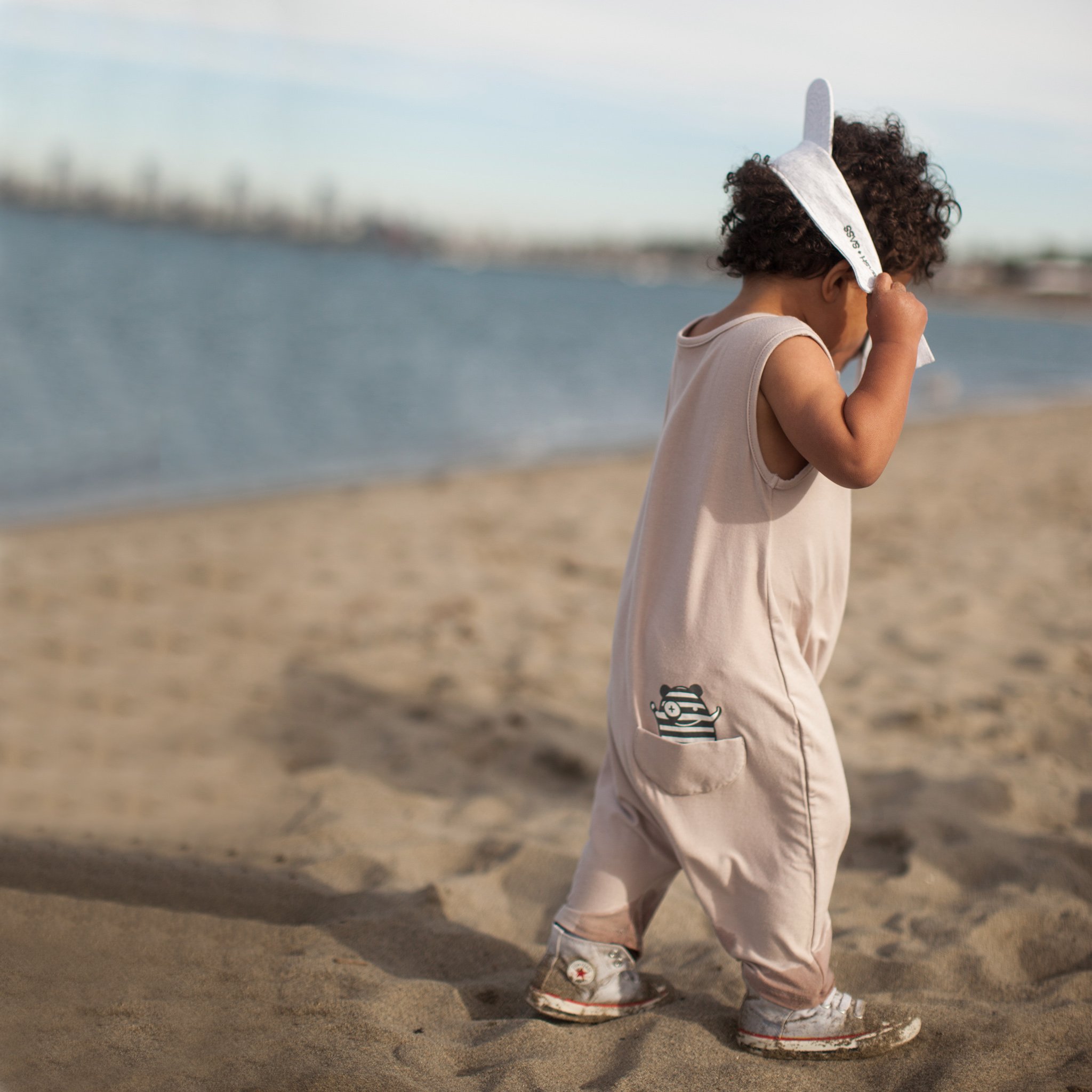 Mocha Tank Romper featuring front buttons and drop crotch design, made from soft rayon and spandex fabric.