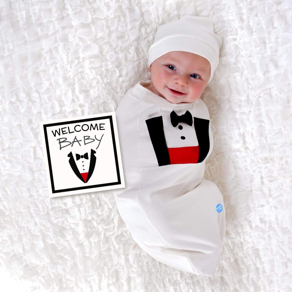 Tuxedo Baby cocoon swaddle set with matching headpiece and announcement card, designed for newborns.