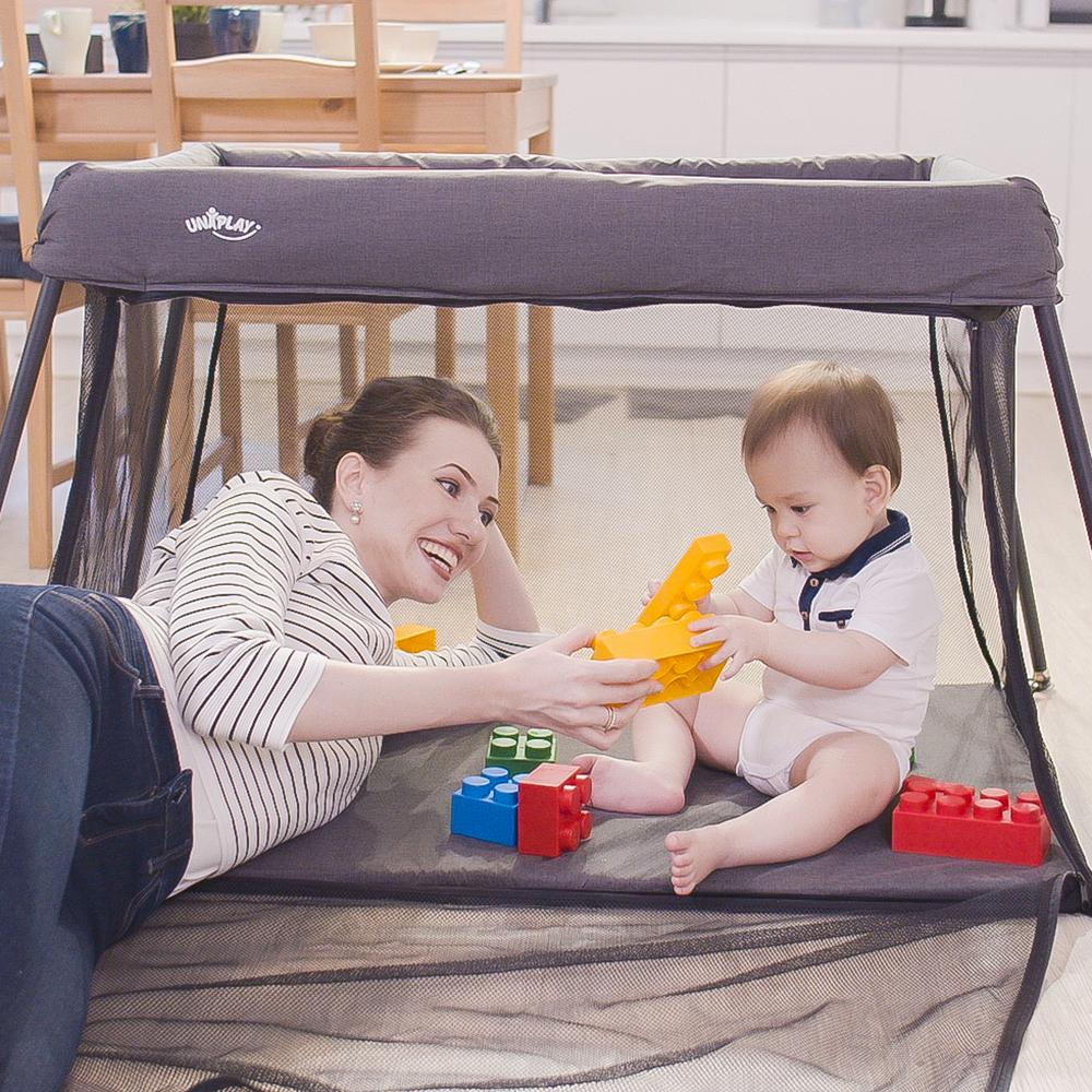 UNiPLAY Portable Playard showcasing its lightweight design and sturdy frame, perfect for travel and easy assembly.