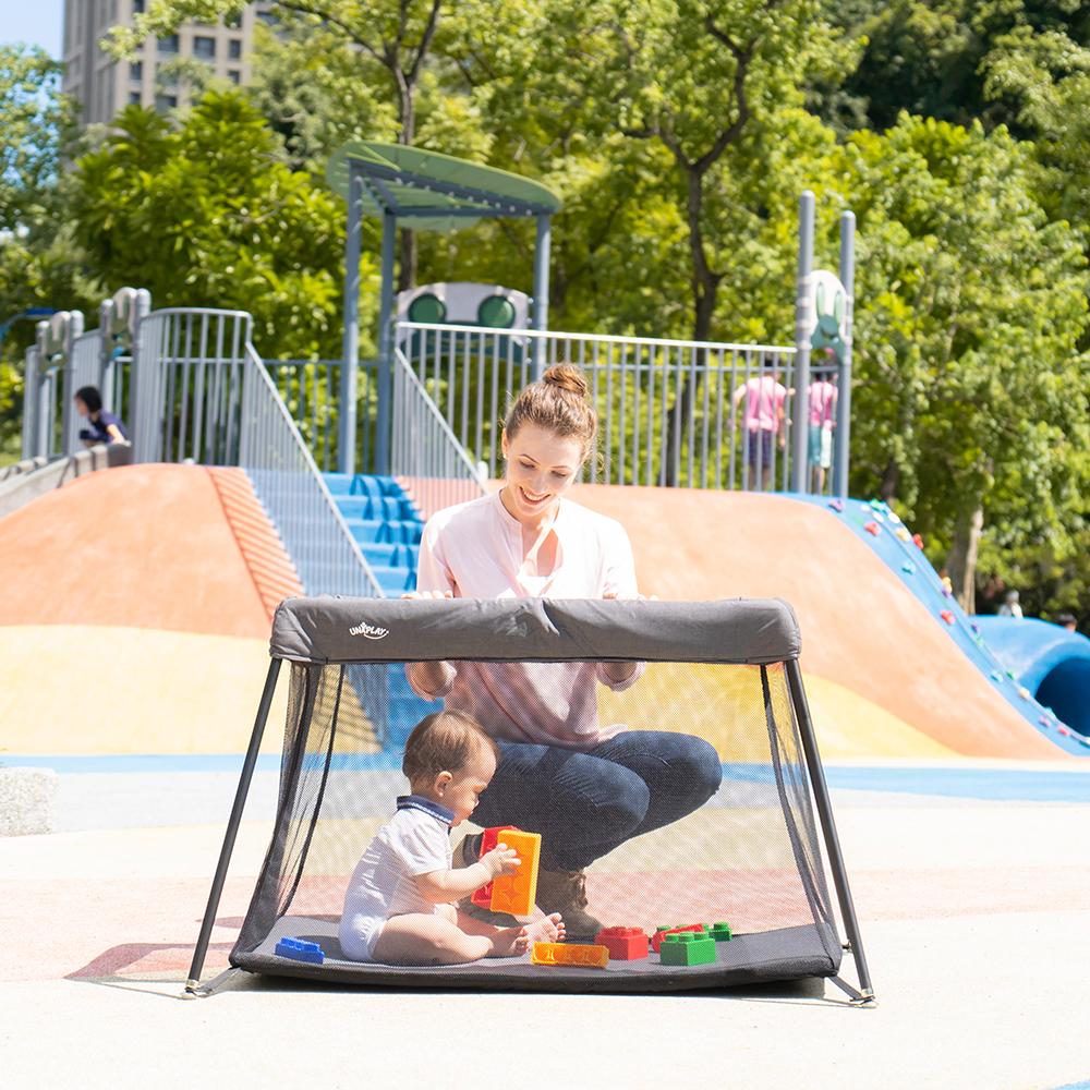 UNiPLAY Portable Playard showcasing its lightweight design and sturdy frame, perfect for travel and easy assembly.