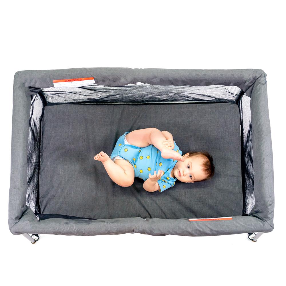 UNiPLAY Portable Playard showcasing its lightweight design and sturdy frame, perfect for travel and easy assembly.