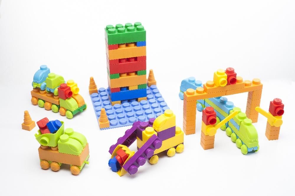 Colorful Uniplay Soft Building Blocks in Traffic Series, featuring various shapes and transport themes, designed for safe and imaginative play.