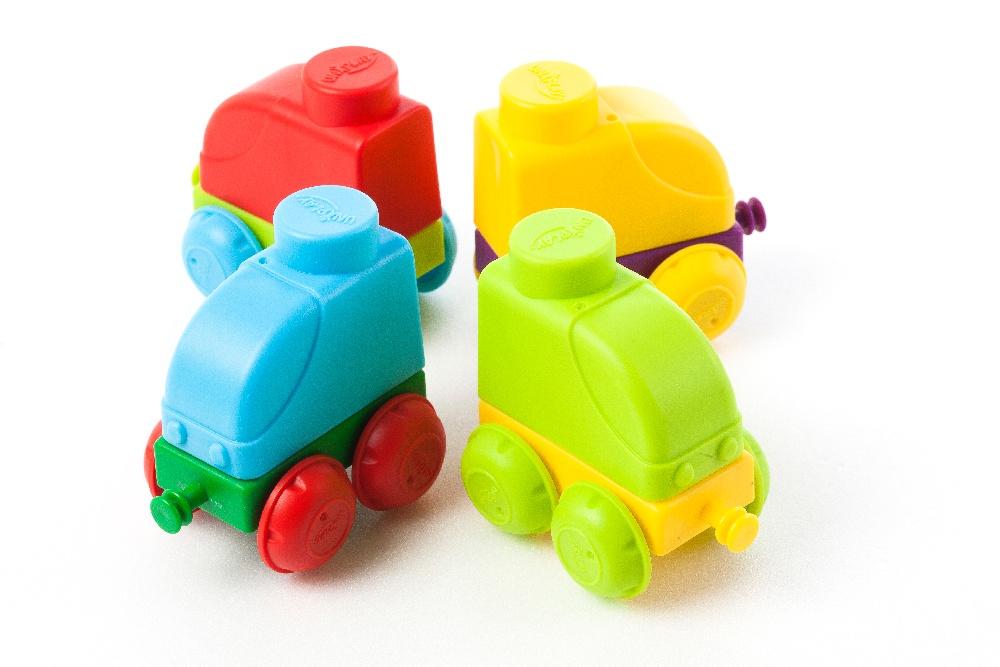 Colorful Uniplay Soft Building Blocks in Traffic Series, featuring various shapes and transport themes, designed for safe and imaginative play.