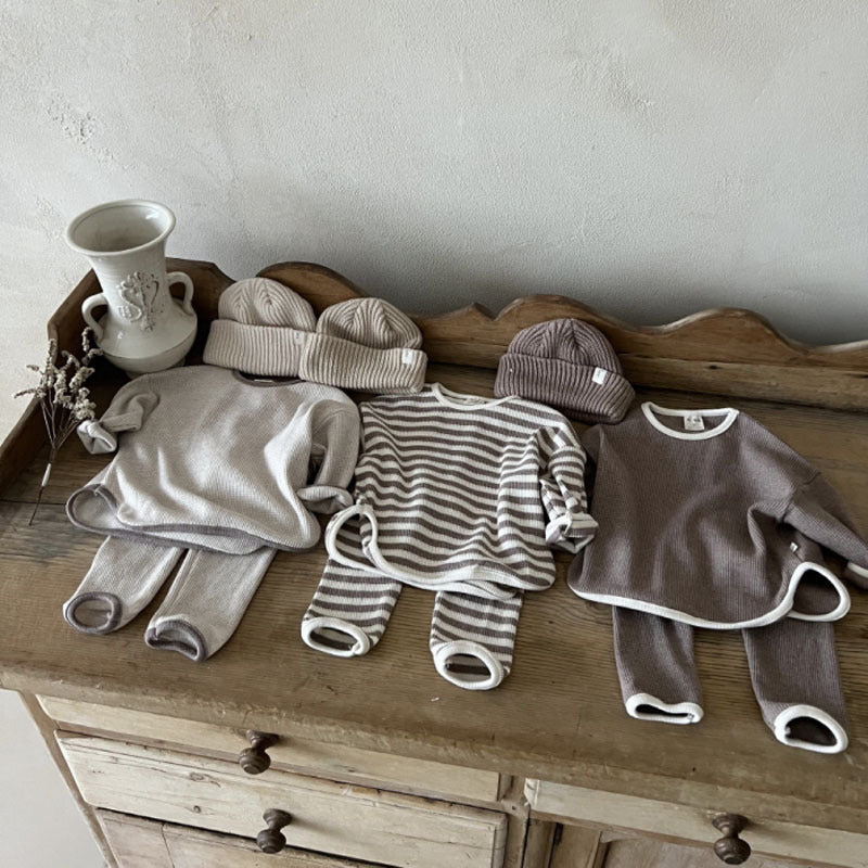 Waffle knitted fabric loose comfy sets in grey, brown, and coffee colors for babies and kids, showcasing soft cotton material and stylish patterns.