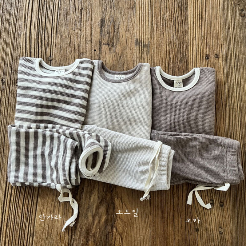 Waffle knitted fabric loose comfy sets in grey, brown, and coffee colors for babies and kids, showcasing soft cotton material and stylish patterns.