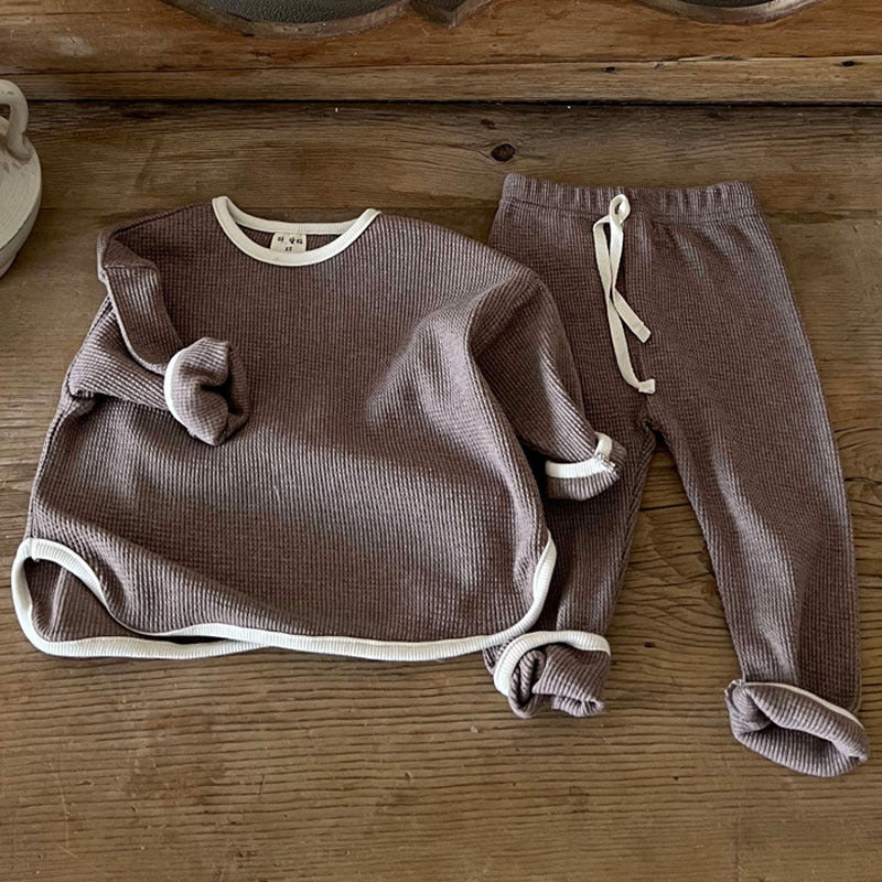 Waffle knitted fabric loose comfy sets in grey, brown, and coffee colors for babies and kids, showcasing soft cotton material and stylish patterns.