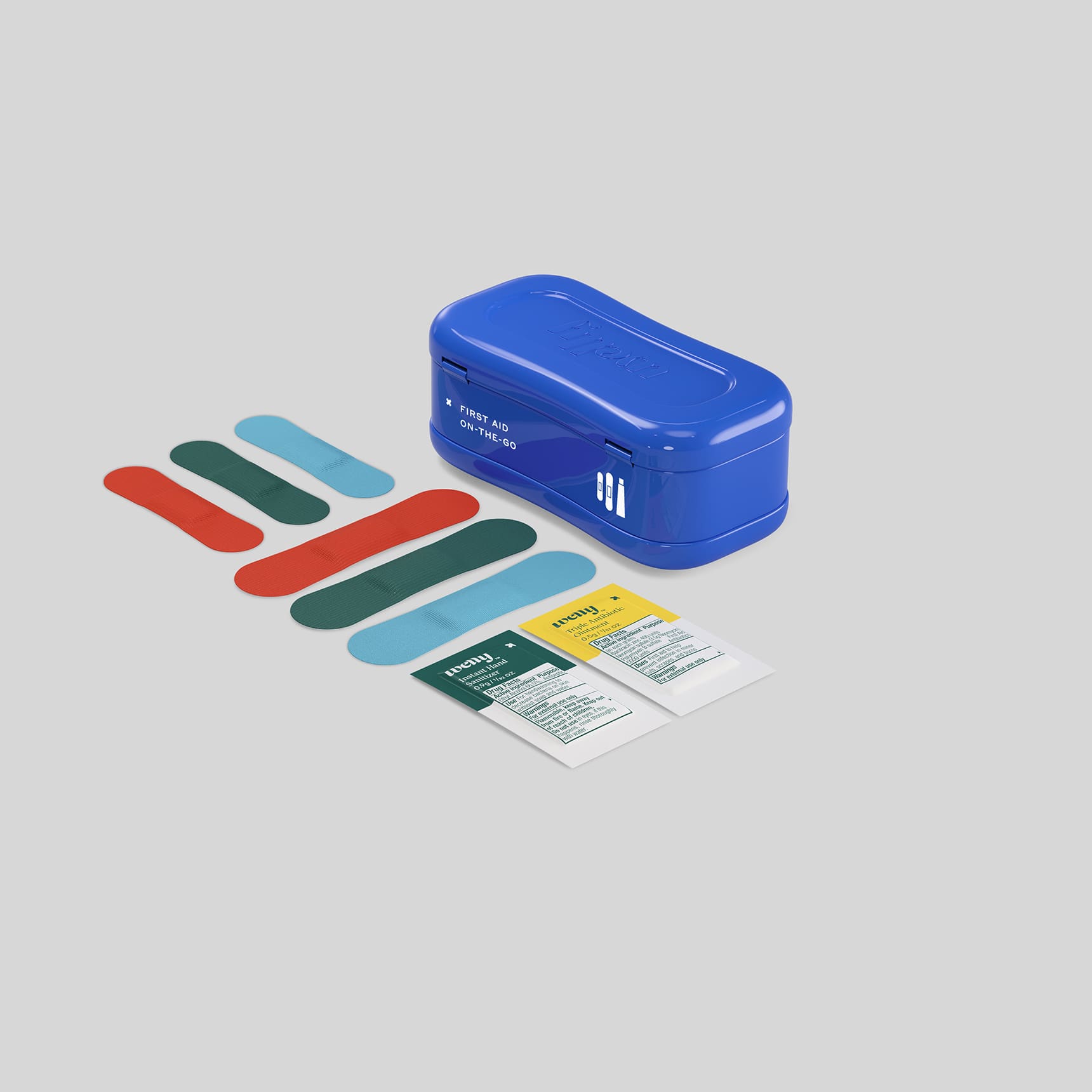 Welly Quick Fix First Aid Kit in a compact tin, featuring colorful bandages and essential first aid supplies.