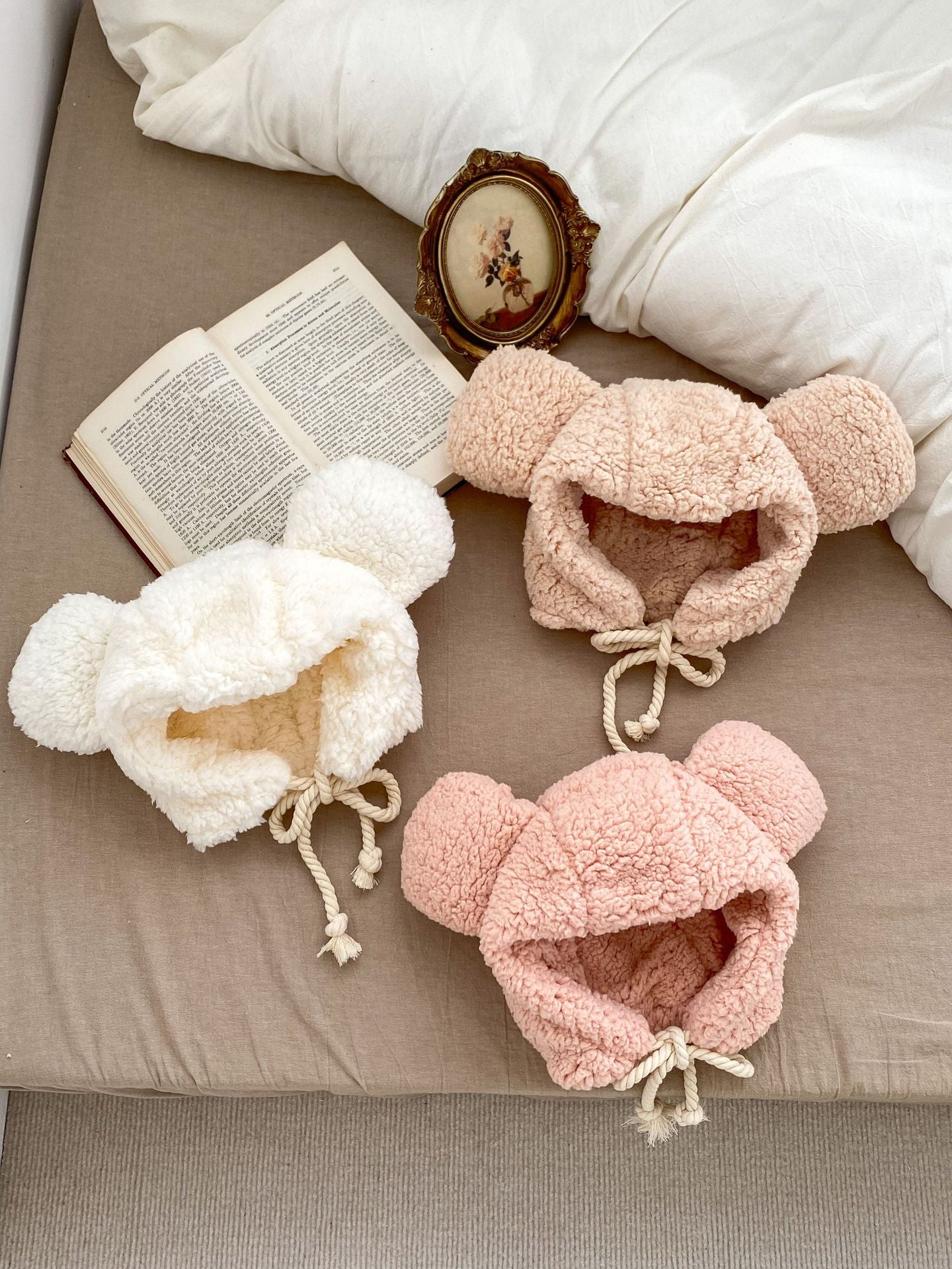 Winter Infant Bomber Hat in pink, khaki, and beige, fluffy thermal material for boys and girls, perfect for cold weather.