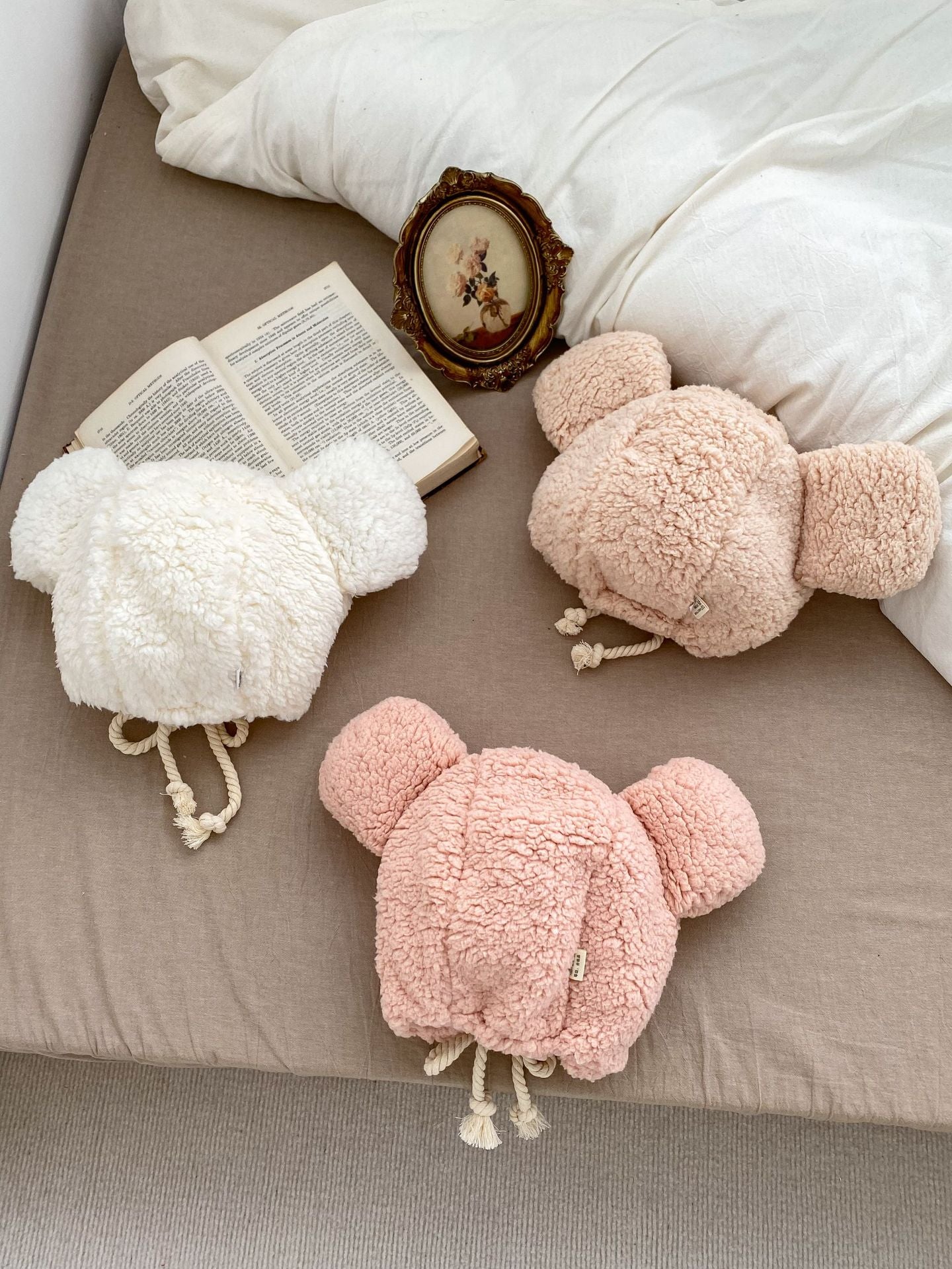 Winter Infant Bomber Hat in pink, khaki, and beige, fluffy thermal material for boys and girls, perfect for cold weather.