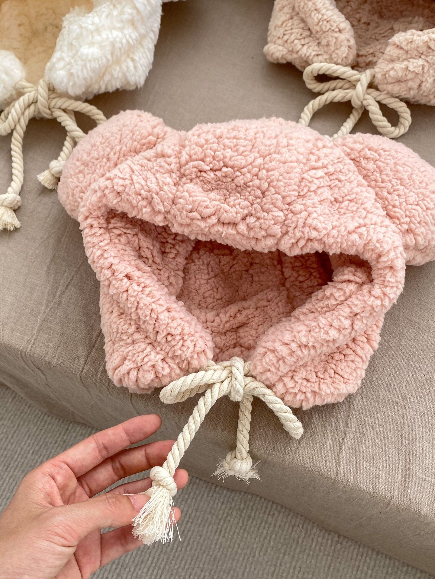 Winter Infant Bomber Hat in pink, khaki, and beige, fluffy thermal material for boys and girls, perfect for cold weather.