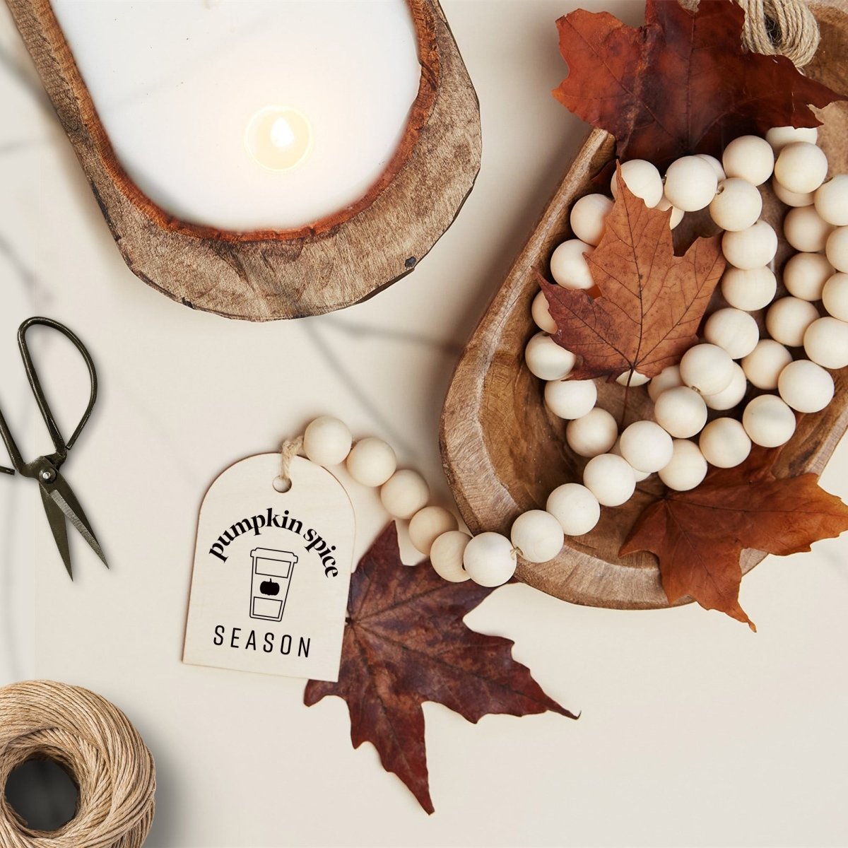 Wood Bead Garland featuring a wooden charm and jute tassel, showcasing natural beads and rustic charm.