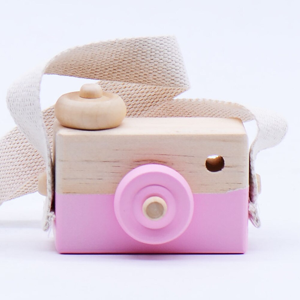 Wooden toy camera with strap.