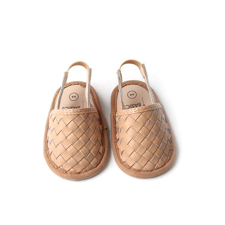 A pair of stylish woven leather sandals in Tawny and Latte colors, designed for toddlers with soft soles and ankle strap buckles.