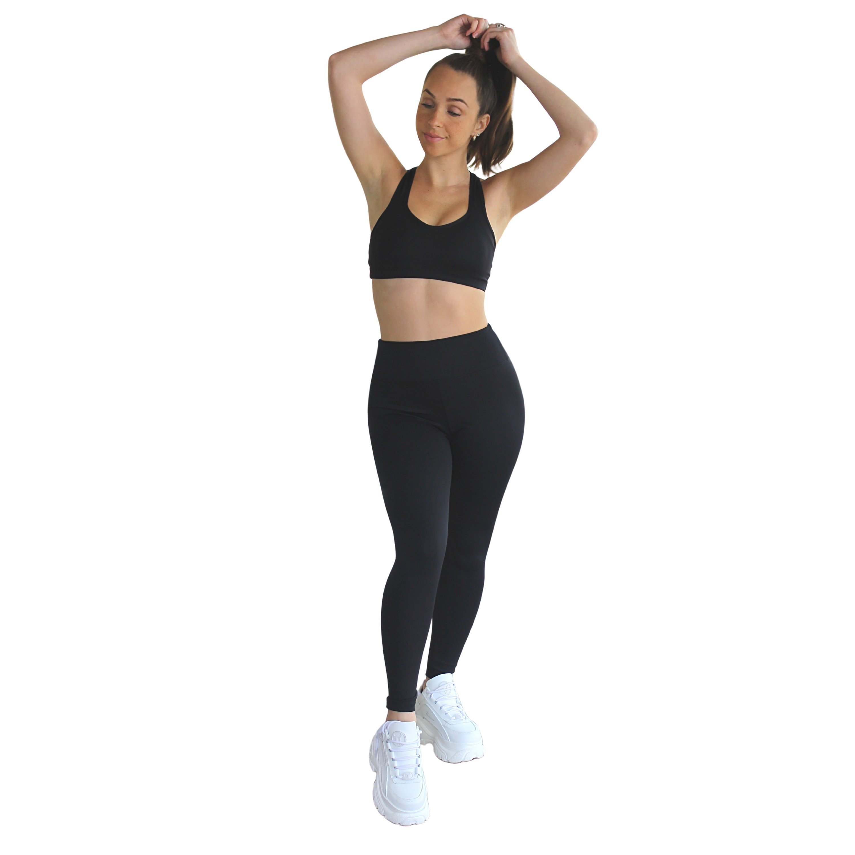 Ananda Racerback Sports Bra in Black, featuring a double-lined design and removable cups, ideal for yoga and fitness activities.