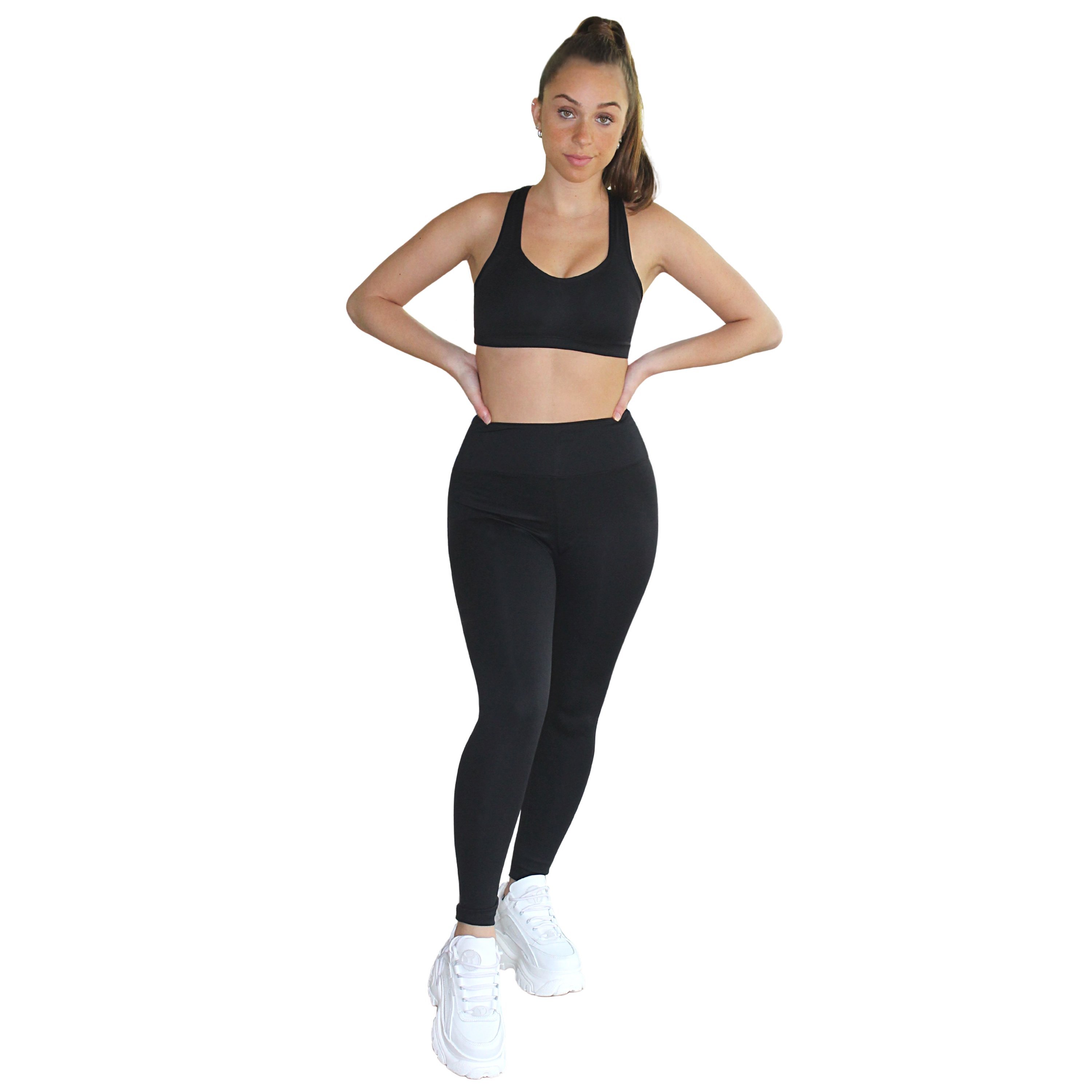 Ananda Racerback Sports Bra in Black, featuring a double-lined design and removable cups, ideal for yoga and fitness activities.