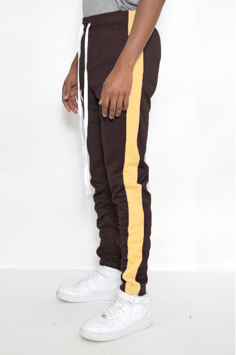 Classic Slim Fit Track Pants featuring a sleek design with a single stripe detail and hidden ankle zipper.