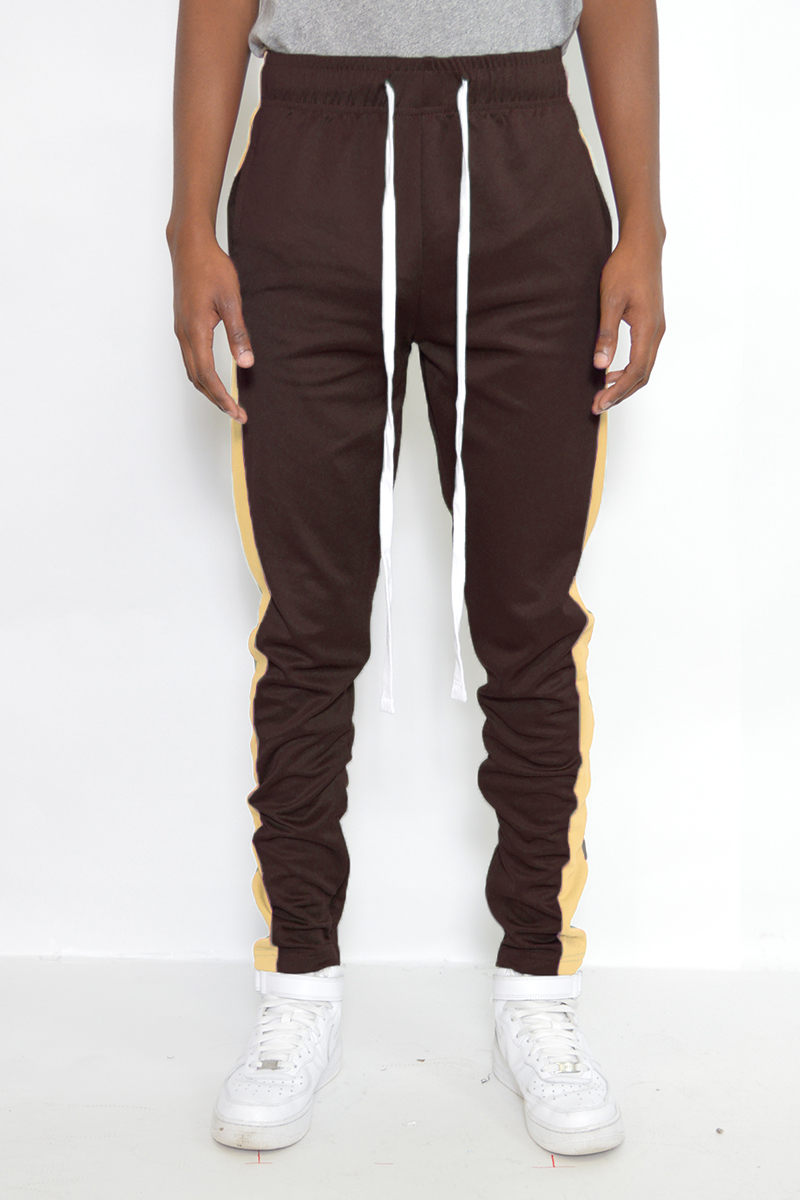 Classic Slim Fit Track Pants featuring a sleek design with a single stripe detail and hidden ankle zipper.