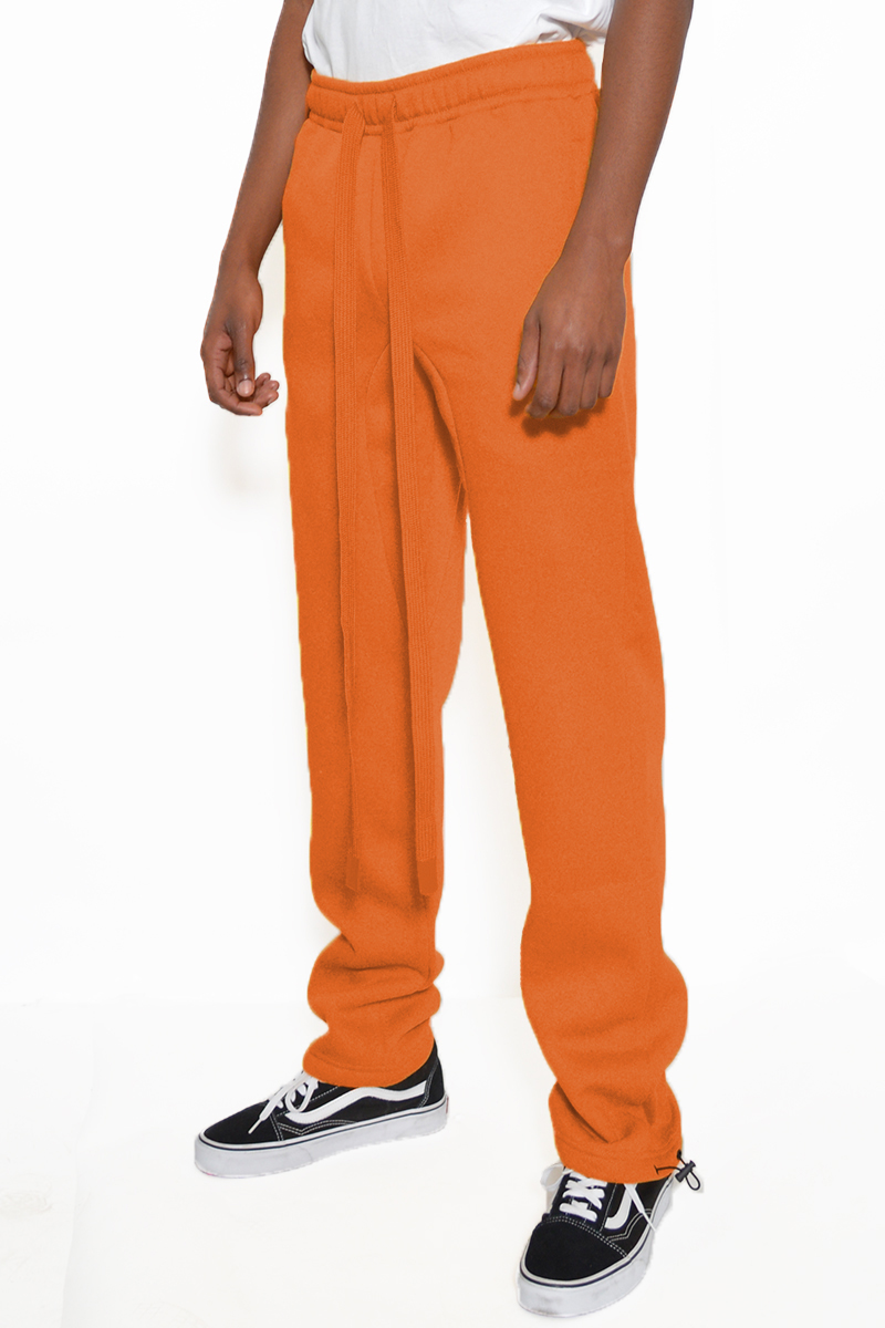 Cotton Fleece Toggle Sweats in a casual setting, showcasing elastic waist and ankle toggle design.