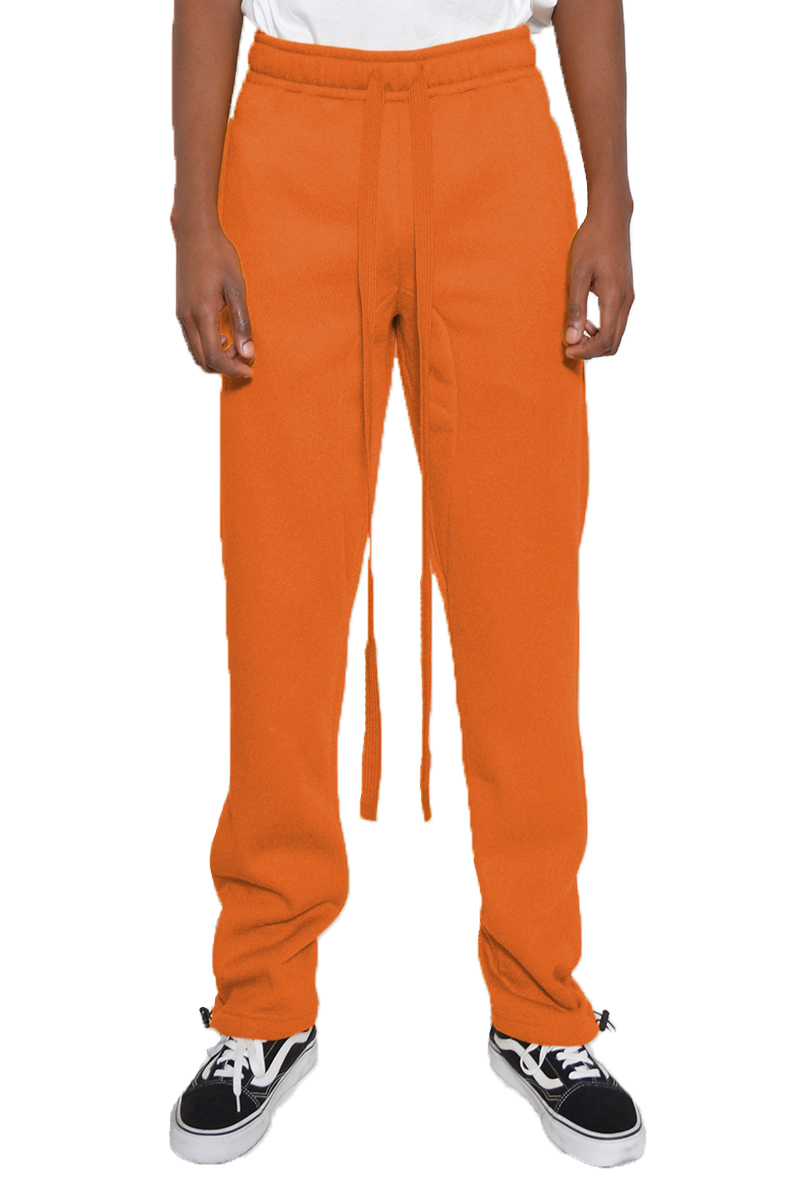 Cotton Fleece Toggle Sweats in a casual setting, showcasing elastic waist and ankle toggle design.