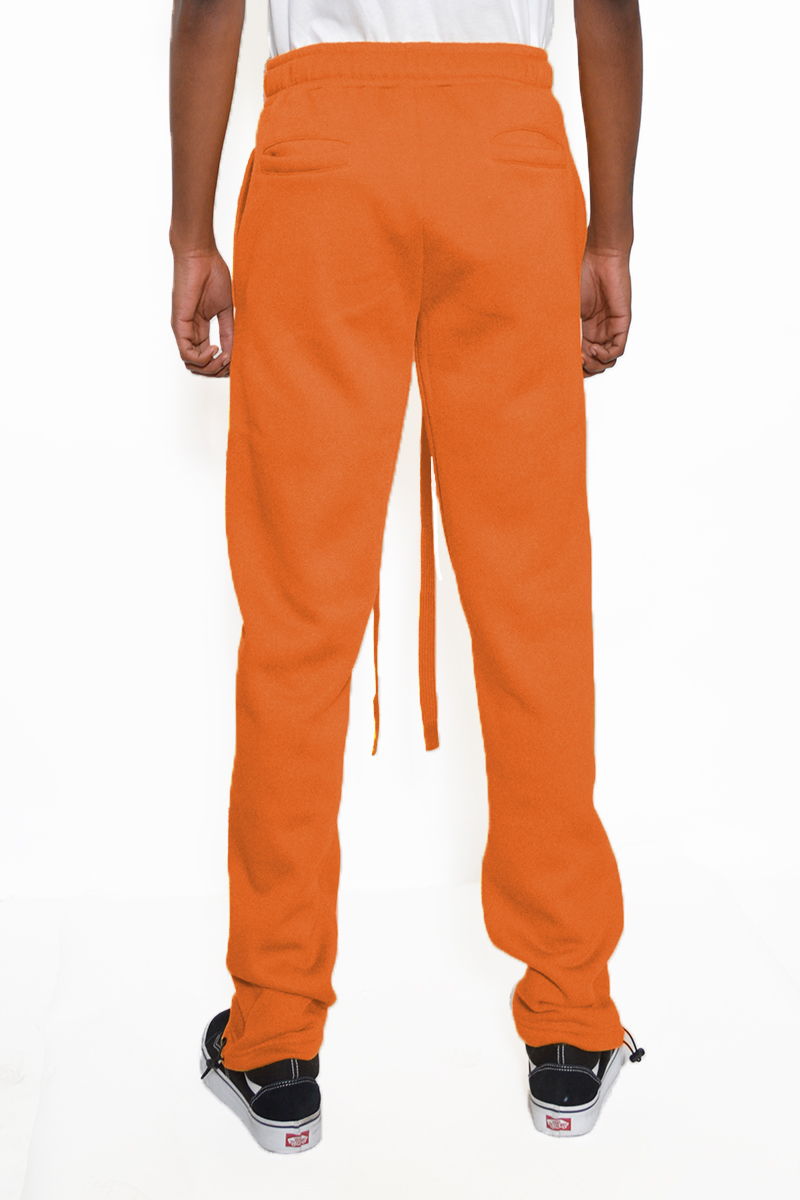 Cotton Fleece Toggle Sweats in a casual setting, showcasing elastic waist and ankle toggle design.