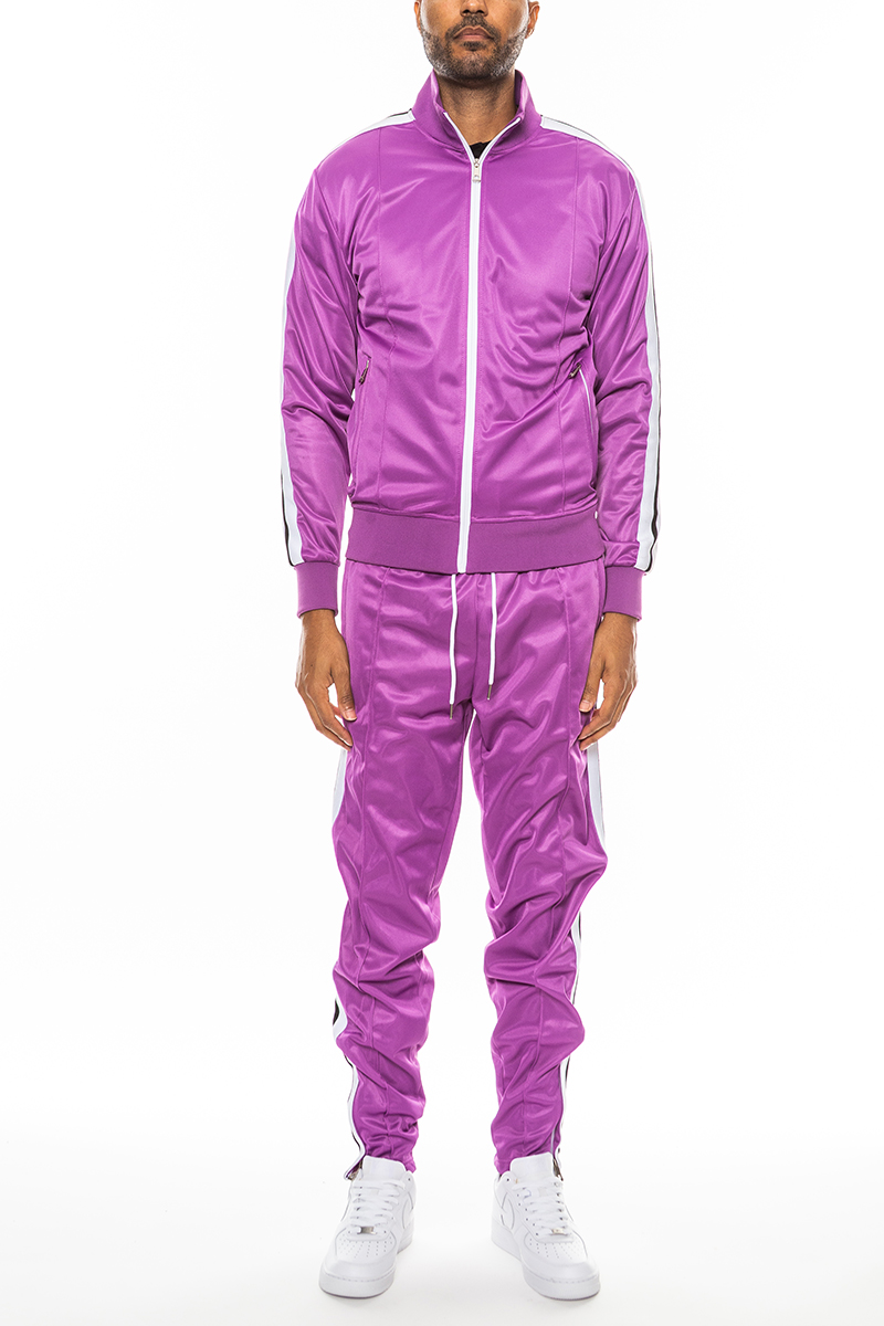 A stylish Striped Tape Front Pleat Track Suit featuring a full zip jacket, elastic waist, and ankle zippers, perfect for casual and athletic wear.