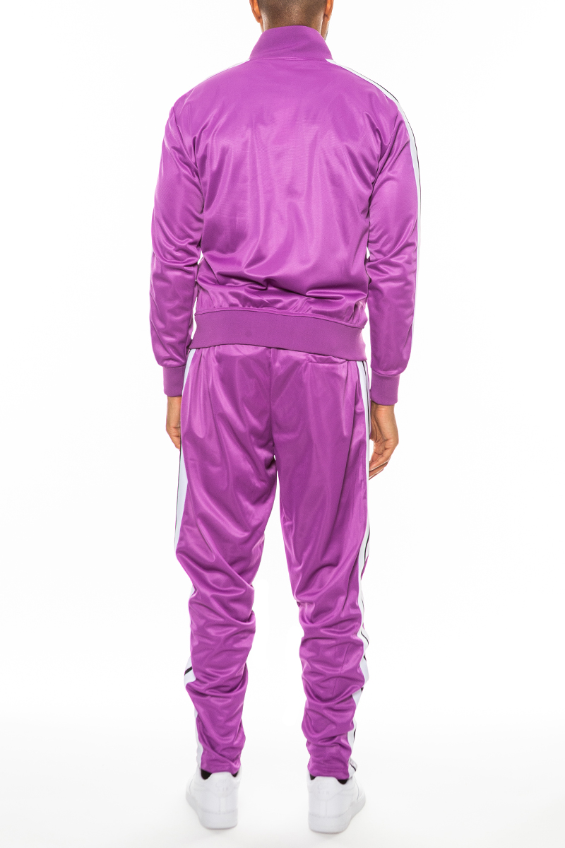 A stylish Striped Tape Front Pleat Track Suit featuring a full zip jacket, elastic waist, and ankle zippers, perfect for casual and athletic wear.