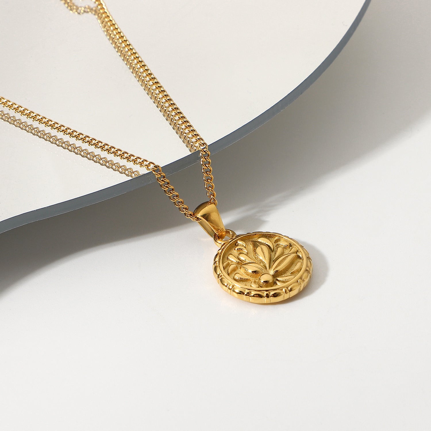 18k Gold Plated 316L Stainless Steel Flower Coin Pendant Medallion with intricate flower design.