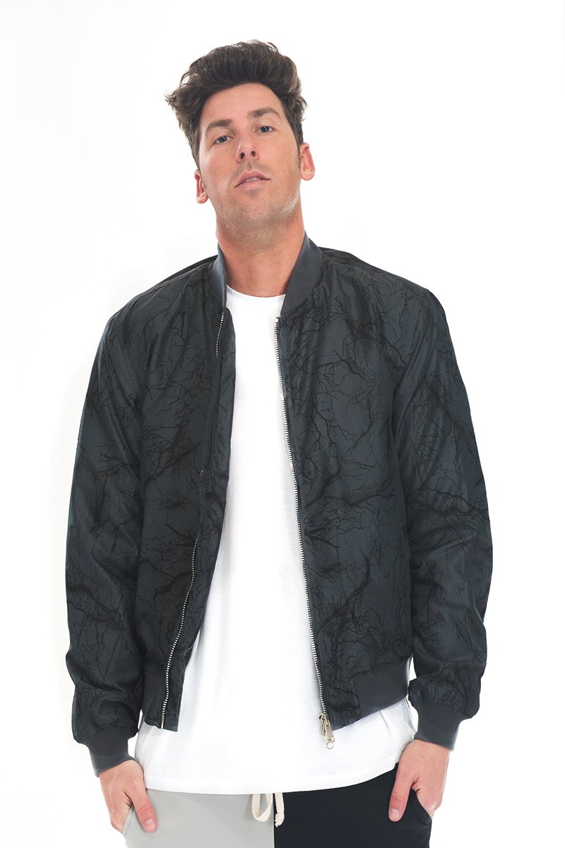 BOLT BOMBER JACKET featuring a thunder print in black, grey color, zipper closure, and ribbed cuffs, perfect for stylish windbreaker wear.