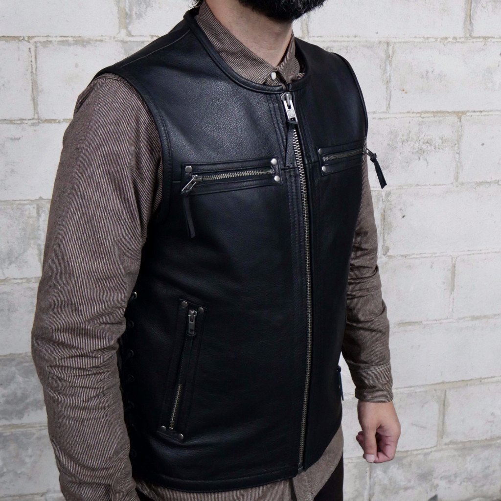 Brawler vest made of premium cowhide featuring a side lace design, zippered pockets, and concealed carry options.