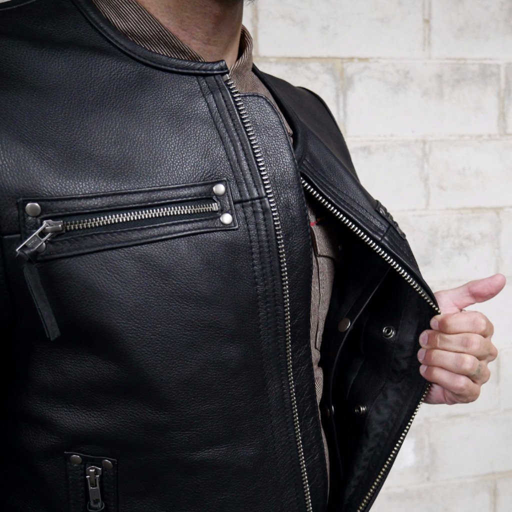 Brawler vest made of premium cowhide featuring a side lace design, zippered pockets, and concealed carry options.