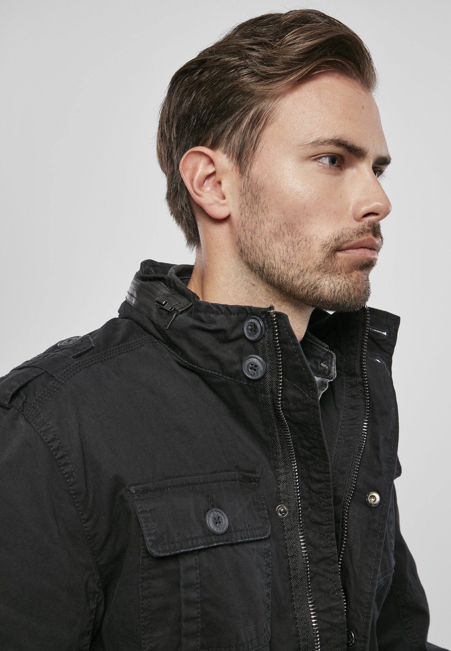 Britannia Jacket featuring a modified field design with faux leather collar and four pockets, showcasing a trendy used look.