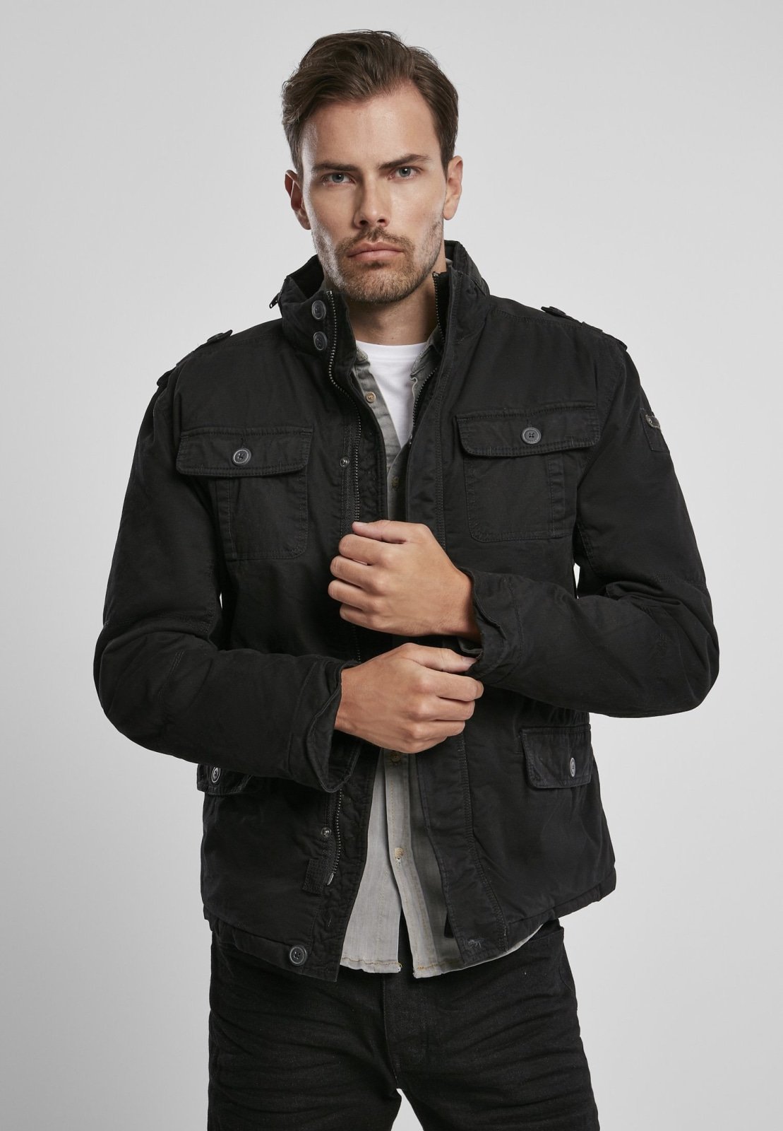 Britannia Winter Jacket featuring a modified field design, teddy lining, hidden hood in collar, and synthetic leather stand-up collar.