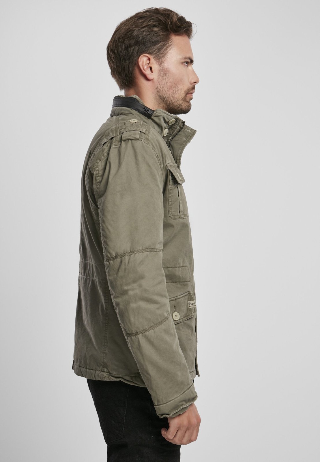 Britannia Winter Jacket featuring a modified field design, teddy lining, hidden hood in collar, and synthetic leather stand-up collar.