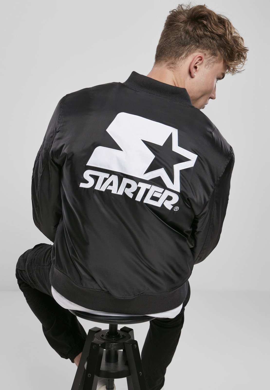 Classic Logo Bomber Jacket featuring a stand-up collar, padding, and zipper, with Starter logo branding on the chest and cuffs.