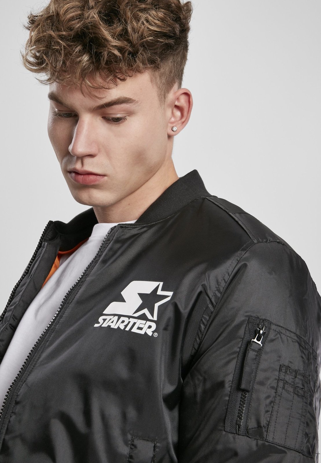 Classic Logo Bomber Jacket featuring a stand-up collar, padding, and zipper, with Starter logo branding on the chest and cuffs.