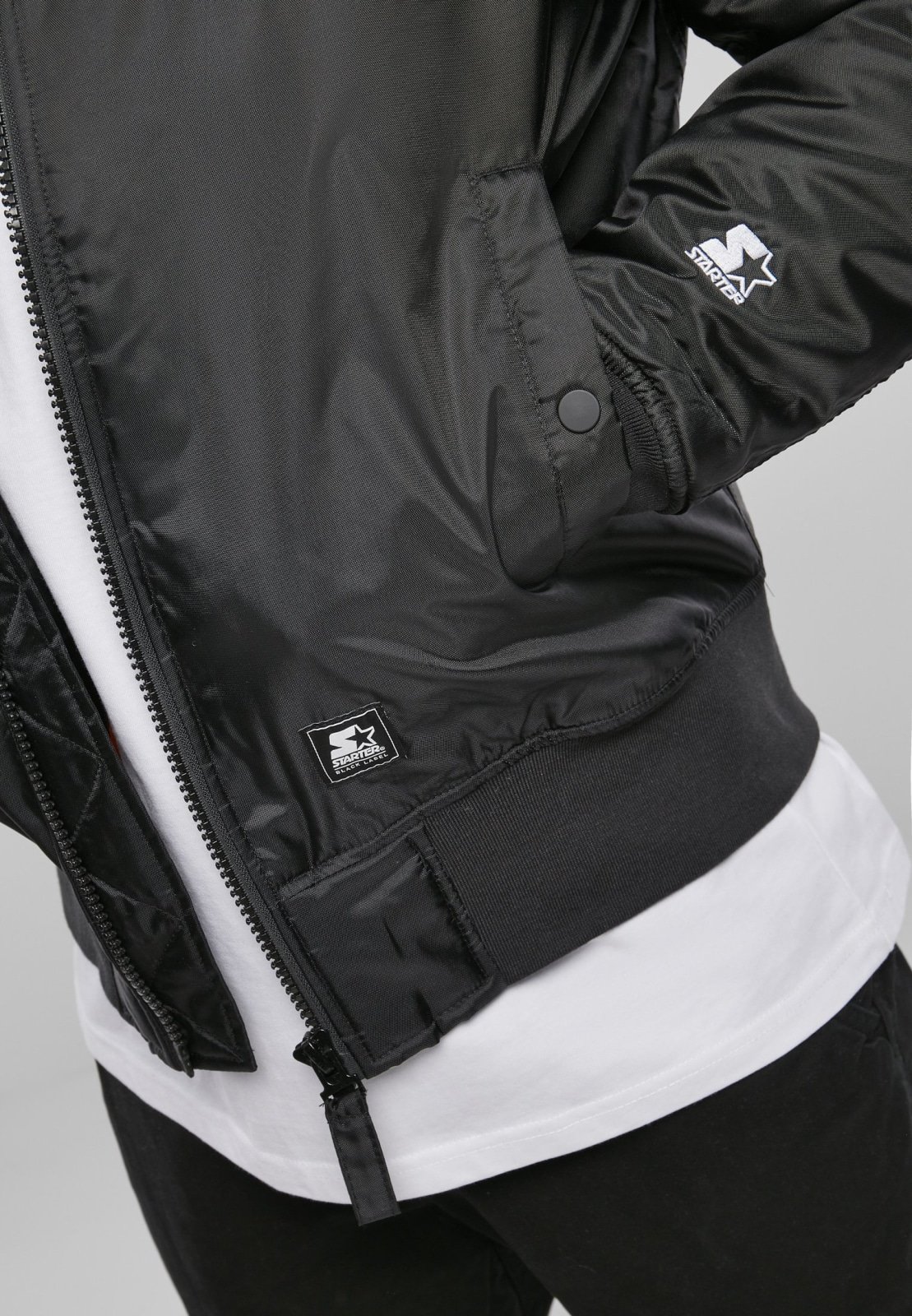 Classic Logo Bomber Jacket featuring a stand-up collar, padding, and zipper, with Starter logo branding on the chest and cuffs.