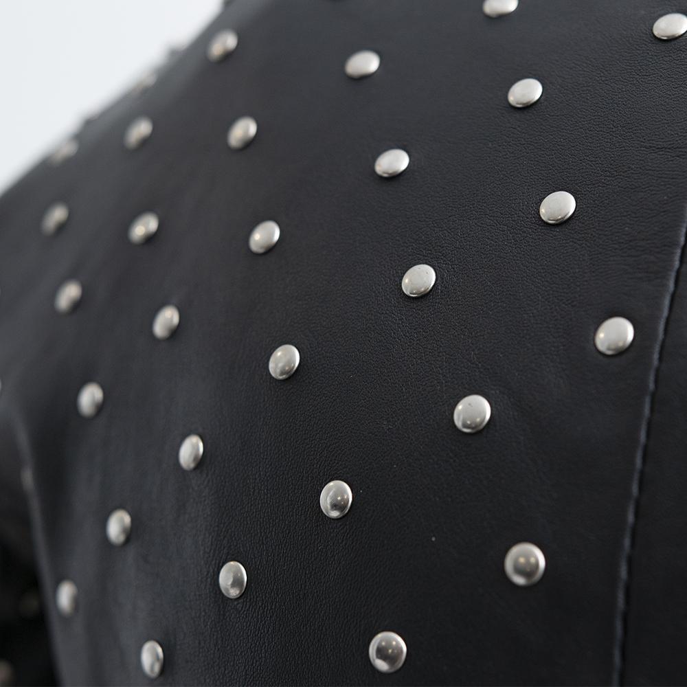 Claudia women's asymmetrical studded jacket made of lamb skin, featuring handcrafted studs and a stylish crossover motorcycle design.