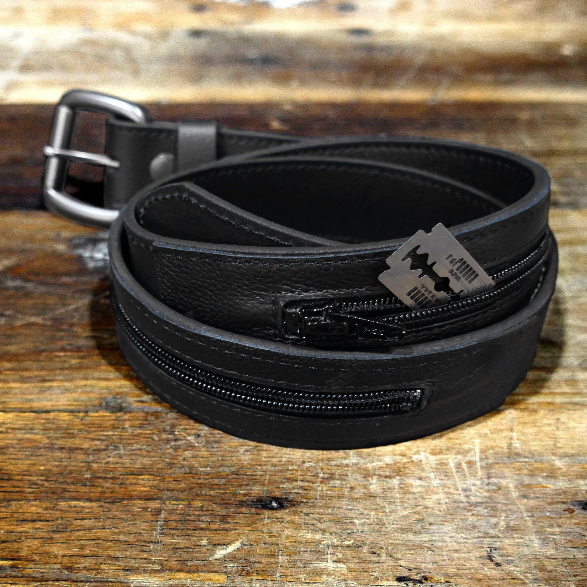 A stylish concealment belt with a hidden zip compartment for secure storage of money and valuables.