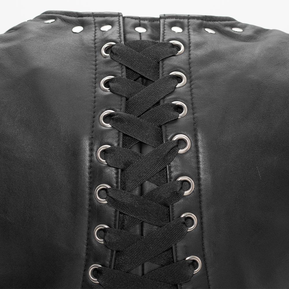 Empress jacket made of diamond sheepskin featuring rivet and corset back detailing, with two welt pockets and concealed carry pockets.