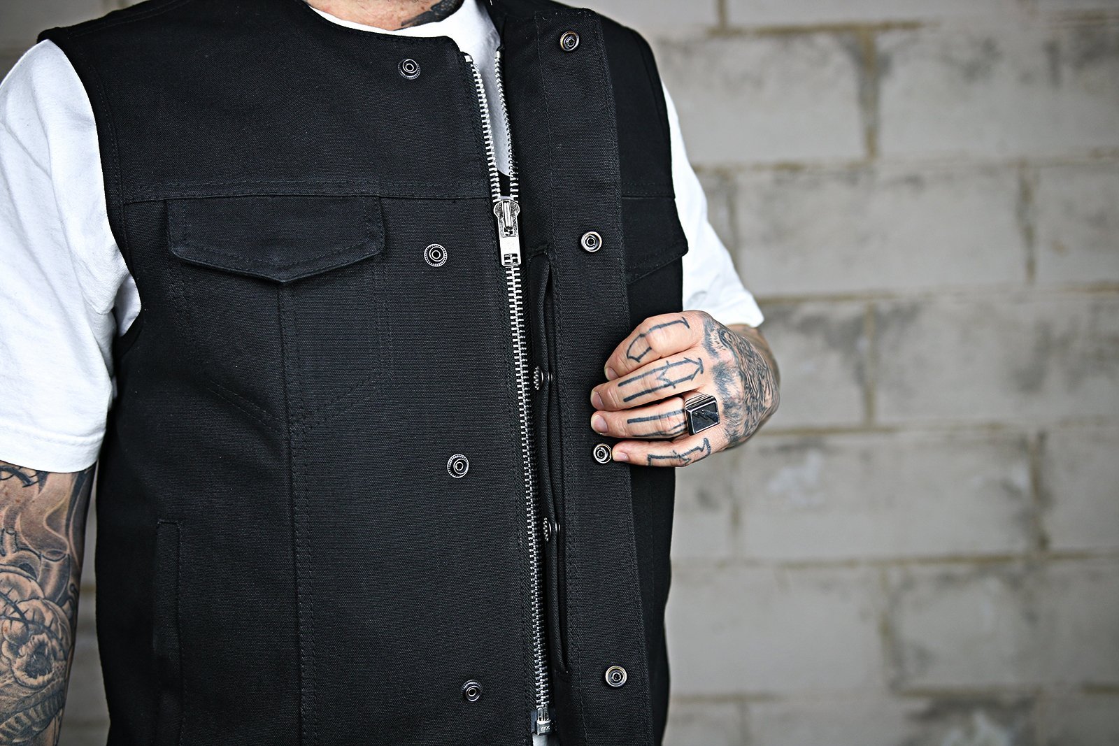 Fairfax Men's Motorcycle Canvas Vest featuring durable raw canvas, multiple pockets, and a classic club style design.