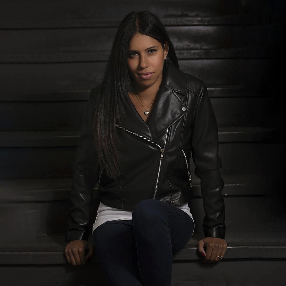 Fatale Women's Vegan Leather Jacket featuring a cropped fit, asymmetrical zipper, and two zippered pockets in a stylish motorcycle design.