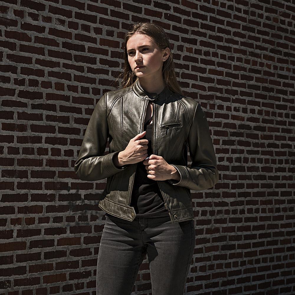 A stylish women's leather jacket made of genuine lambskin, featuring a zipper front, long sleeves with adjustable cuffs, and multiple pockets.